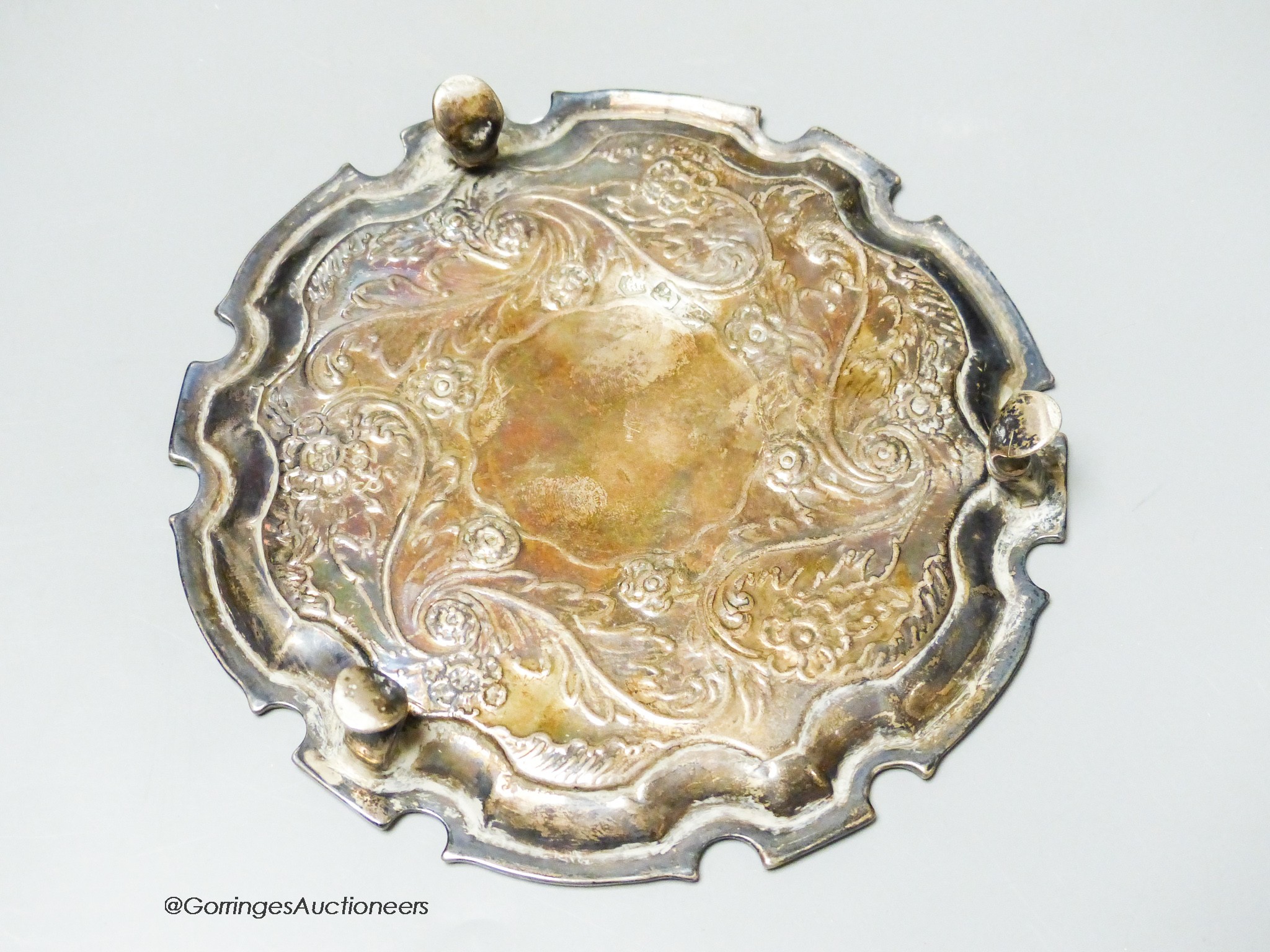 A George II silver salver with later embossed decoration, Robert Abercrombie, London, circa 1730, 15.cm, 6.5oz.